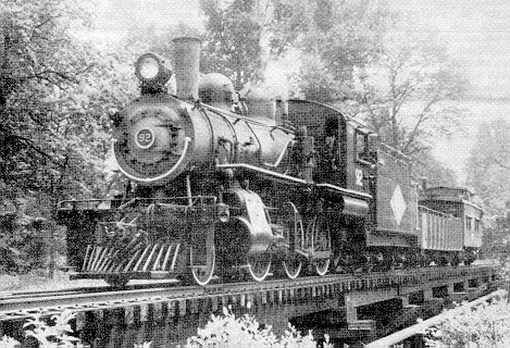 The photo shows 92 pulling a work train across the trestle at Hercules. This was a brush cutting trip, one of the few times 92 operated without the usual passenger equipment. 